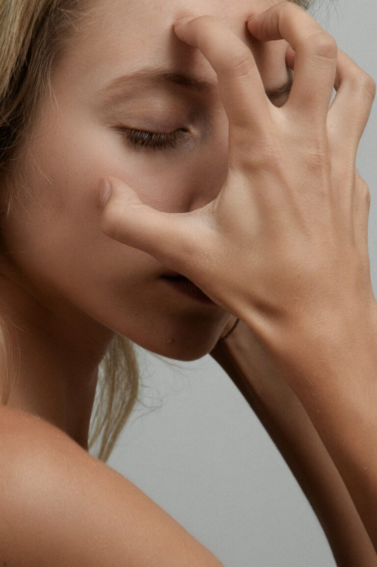 women scratching face with hand combination skin