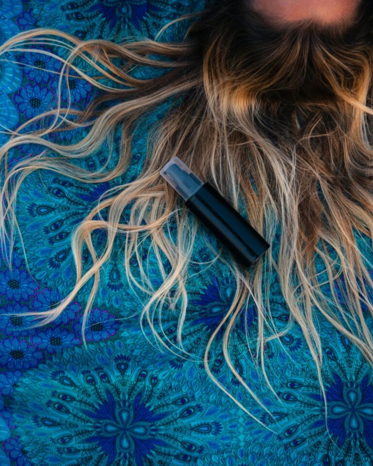 women lying on blue background with messy hairs