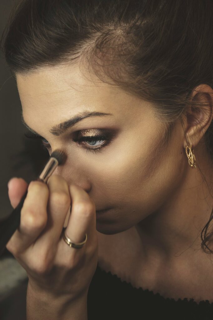 women applying eye makeup
