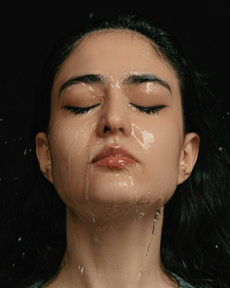 oily skin face women washing off with water