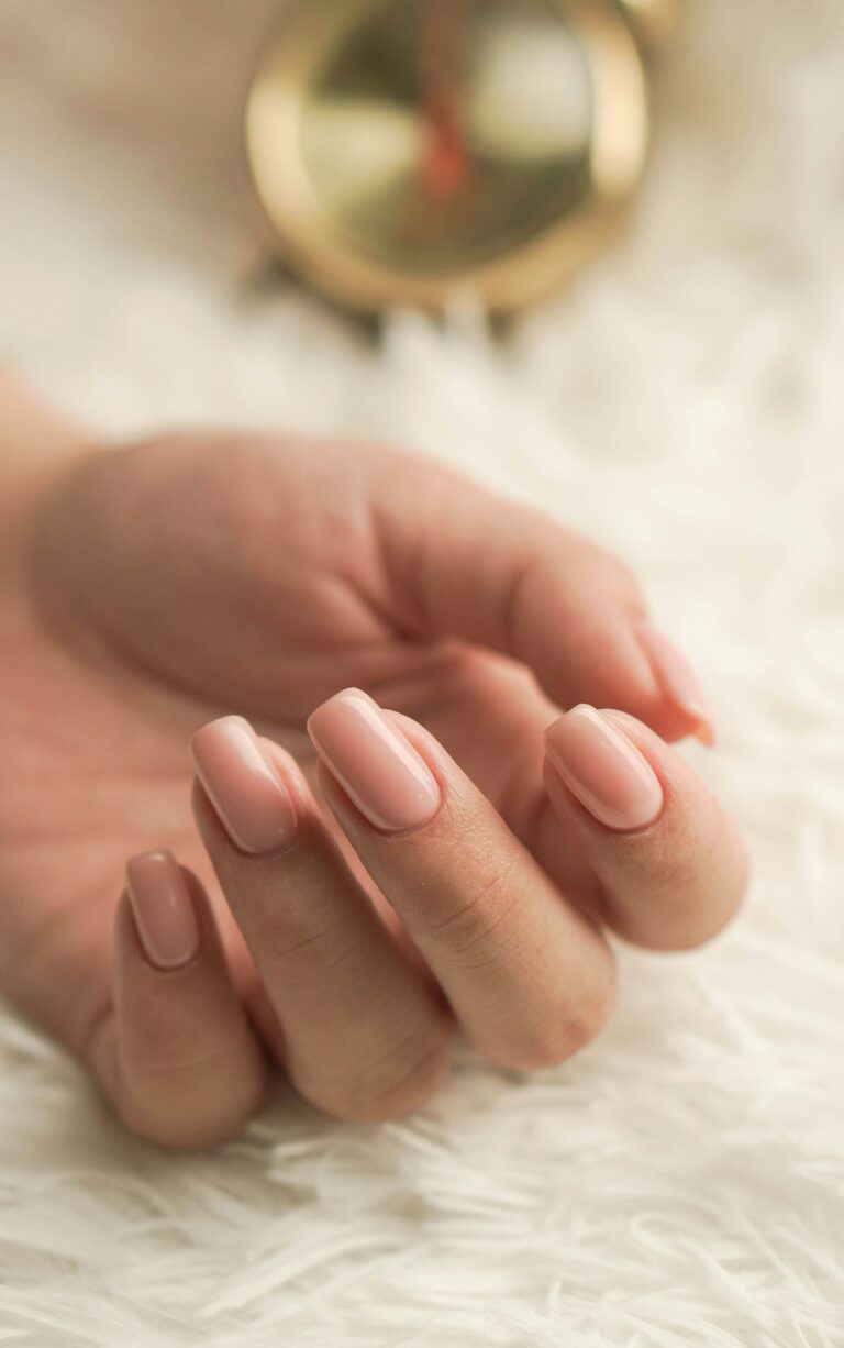 peach color long nails on white background