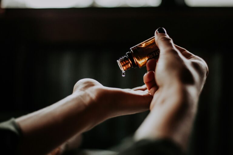 hand holding hair oil