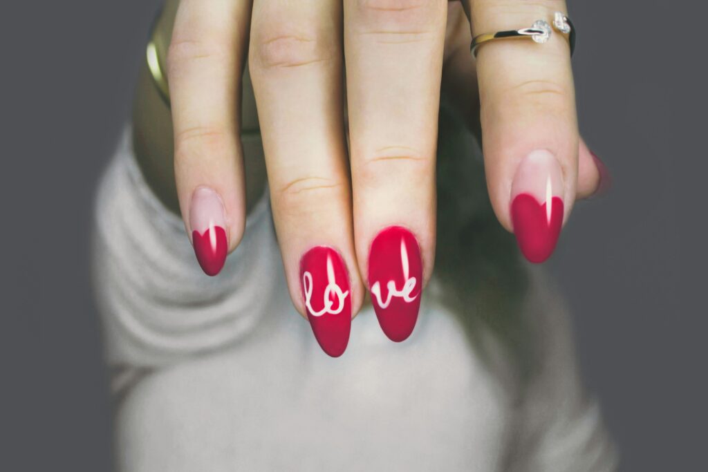 dark pink nails with love written