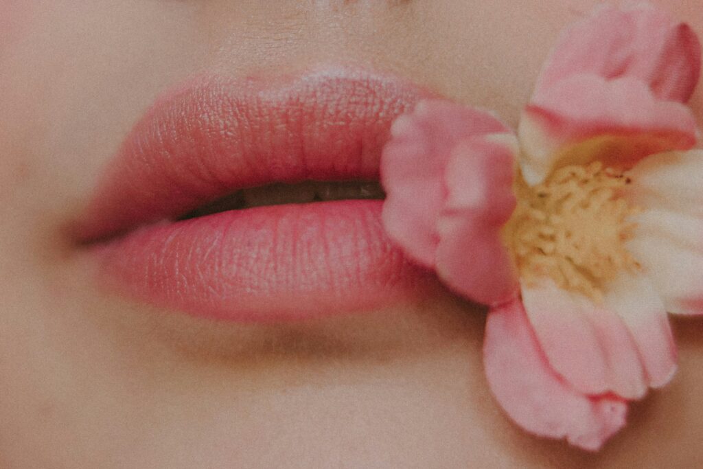 closeup of lips with a flower