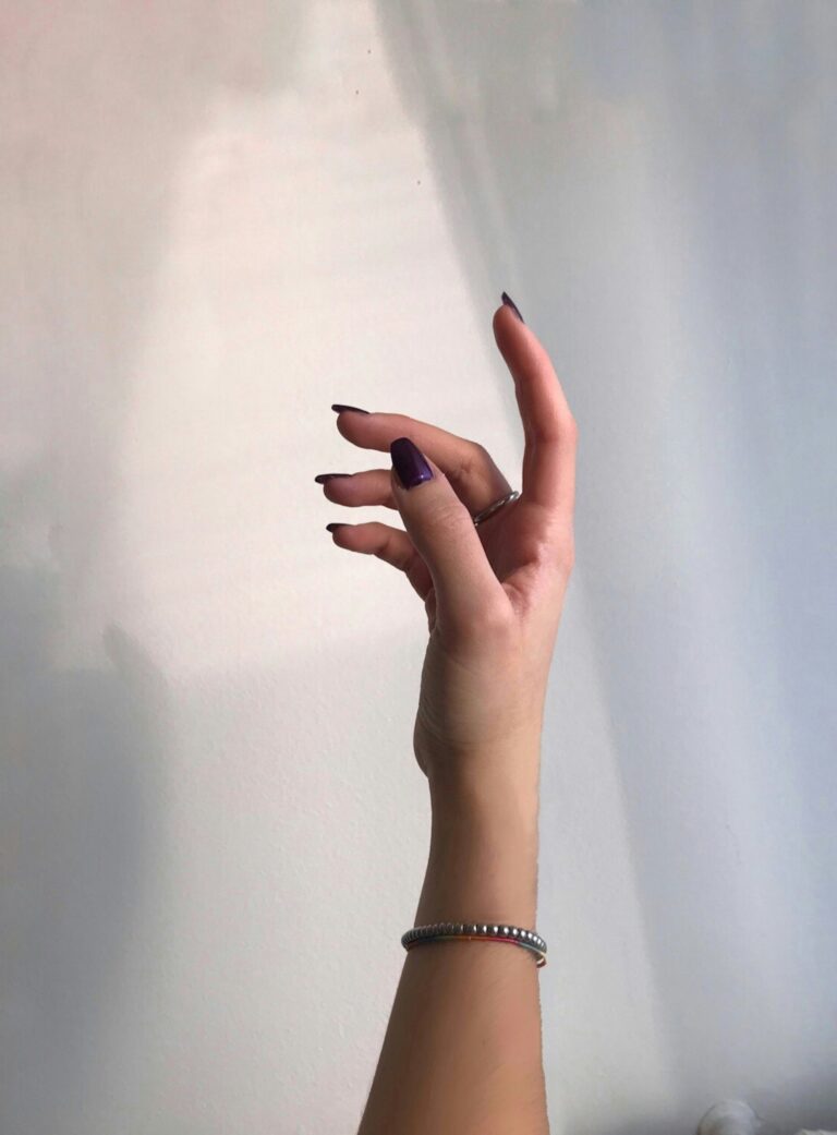beautiful hands with black nails