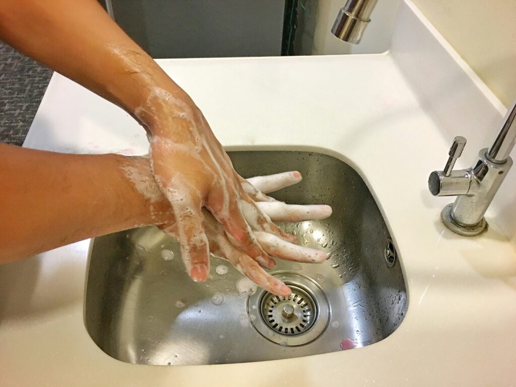 washing hands in a sink