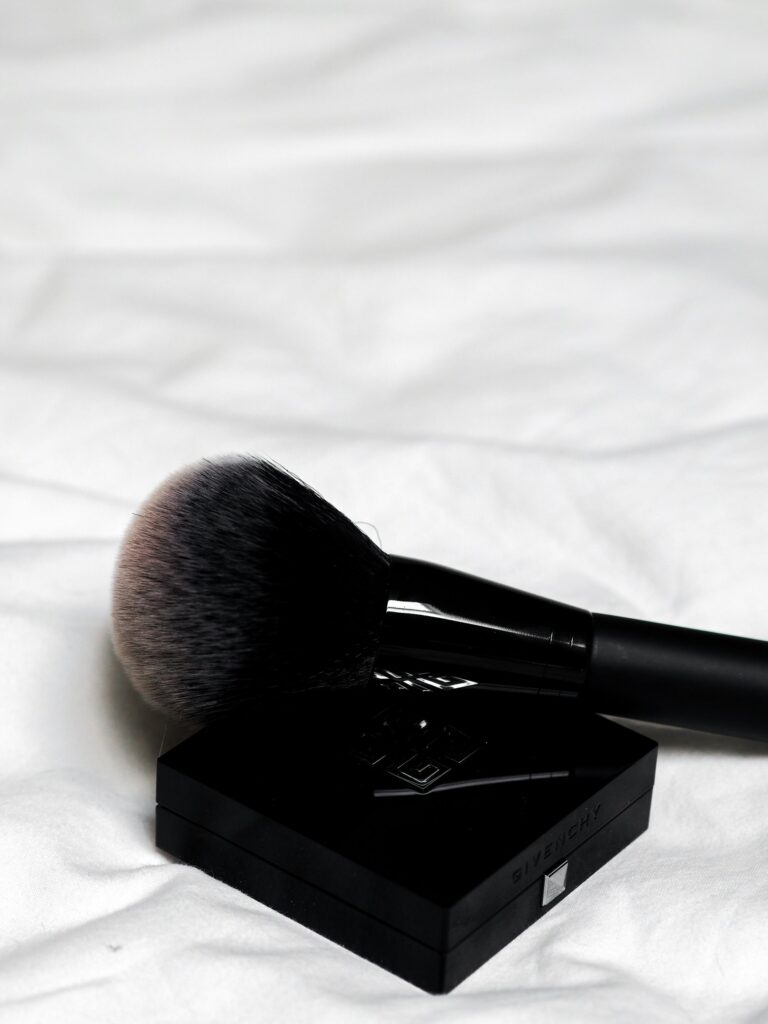 a face blush container and blush brush