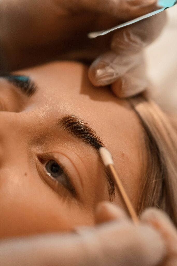 women getting eyebrows fixed