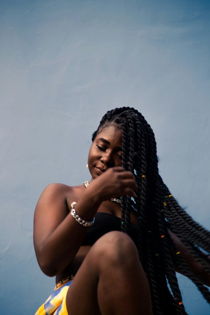 black women doing hair care