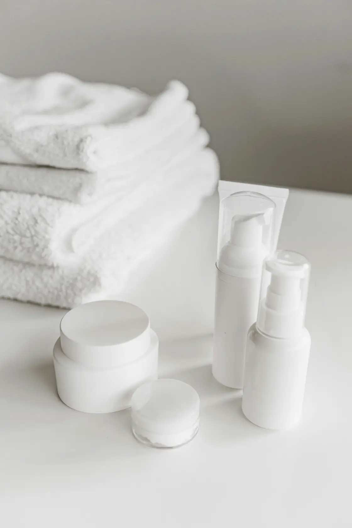 organic moisturizer jar beside aloe leaves