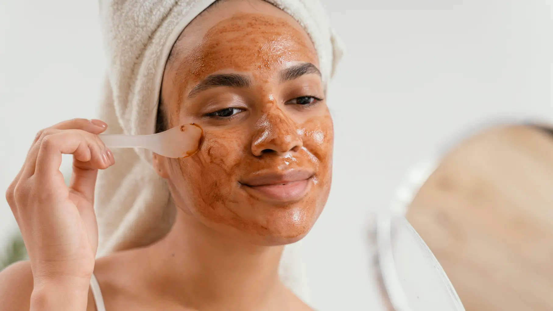 woman applying DIY acne face mask