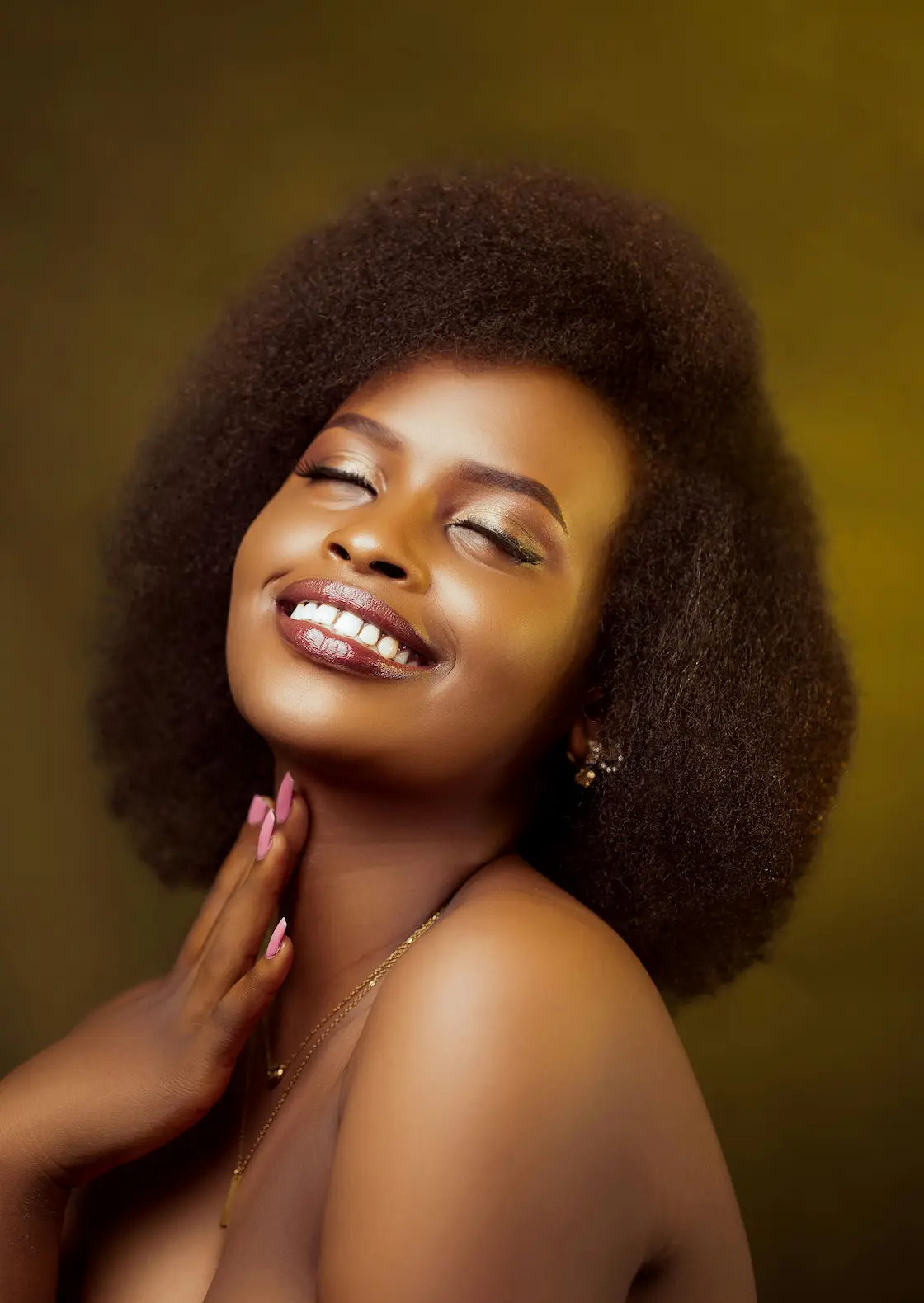 Woman with glowing skin after using plant based anti aging serum, smiling brightly