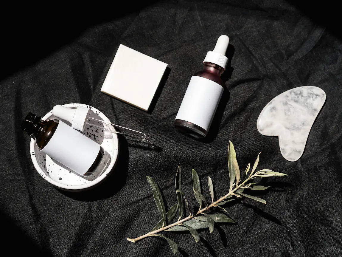 Best plant-based anti-aging serums in glass bottles on white background