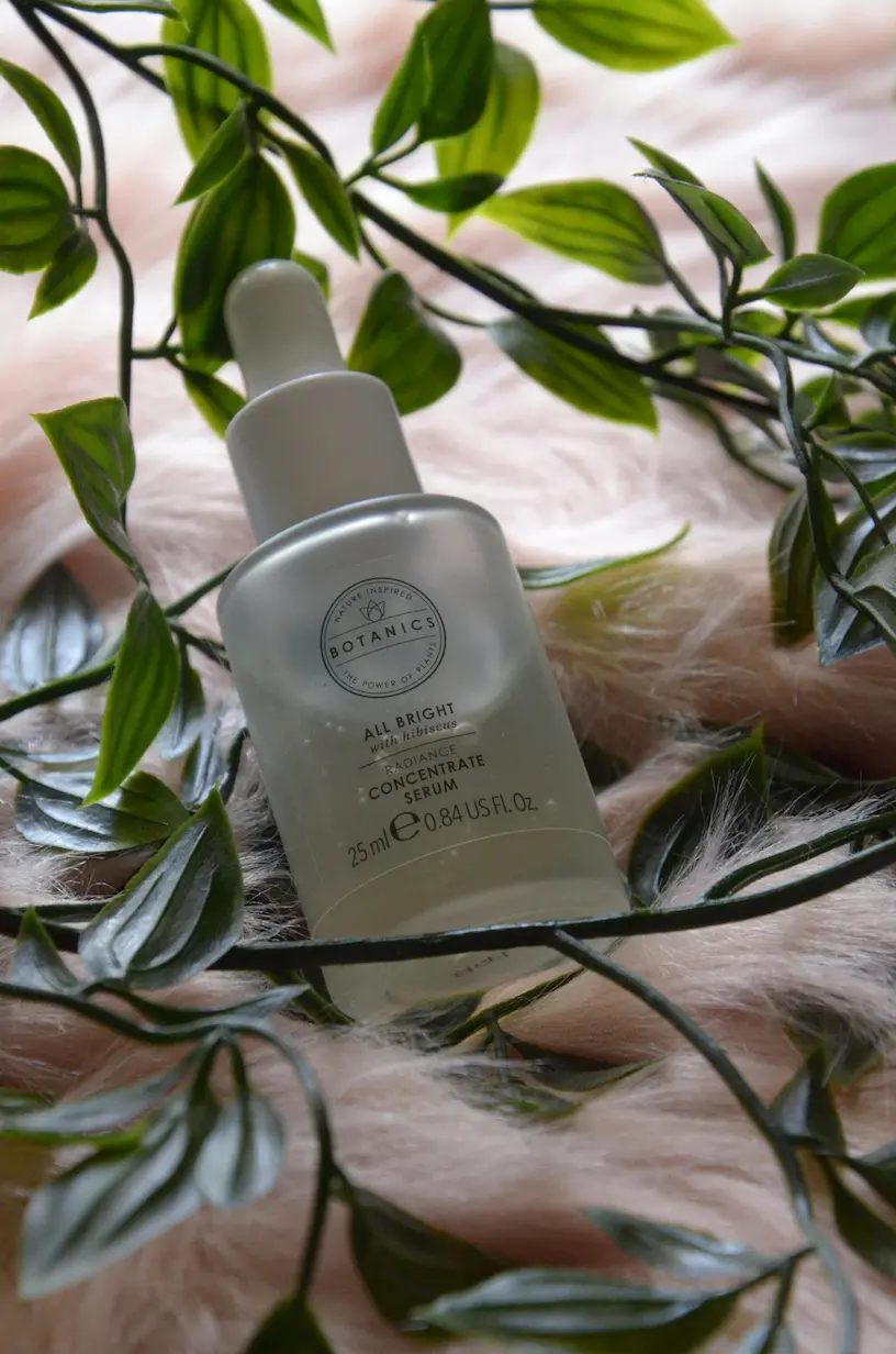 Applying plant-based anti-aging serums from dropper for youthful skin