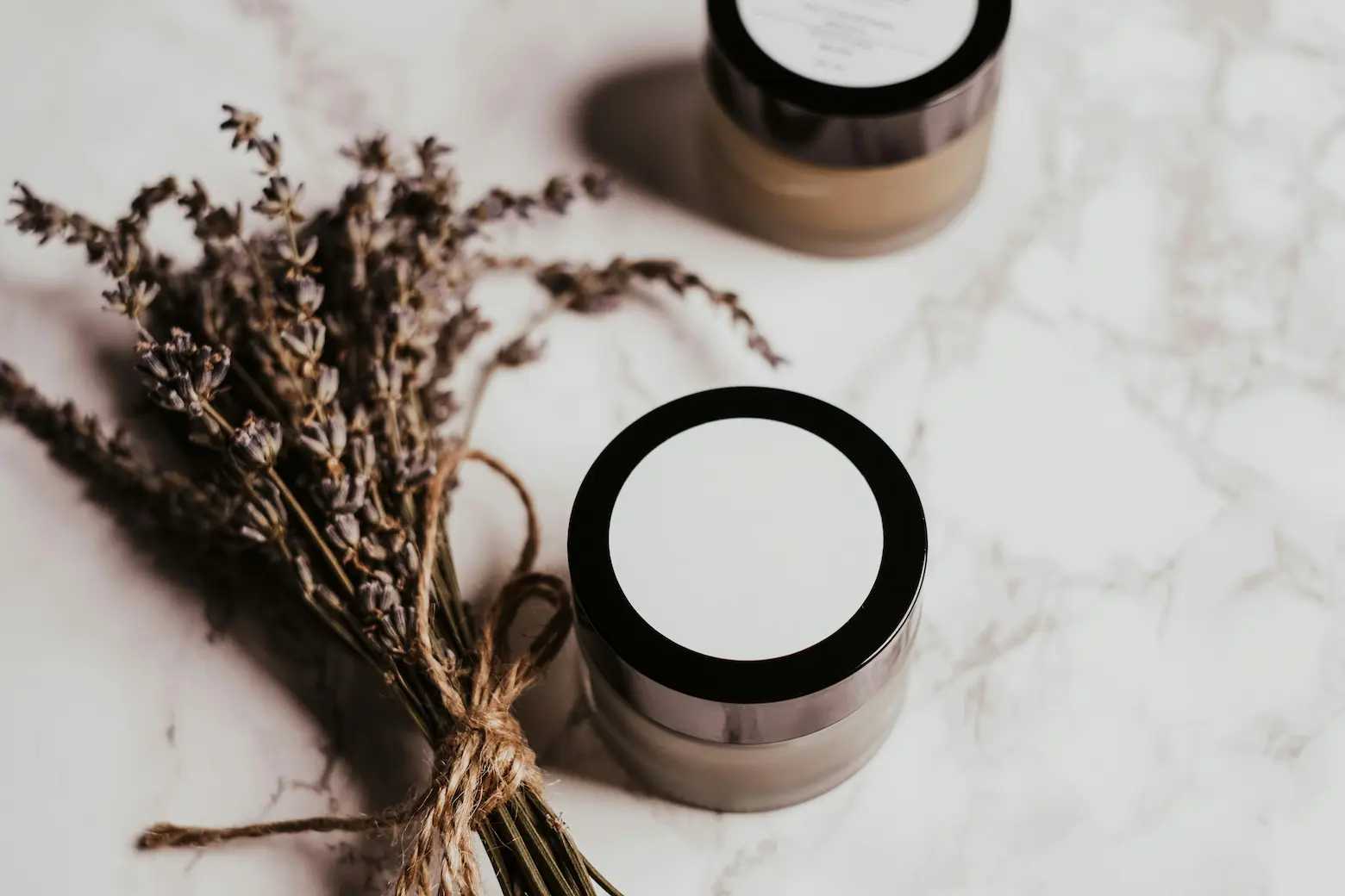 Night cream jar on vanity for skin repair while sleeping